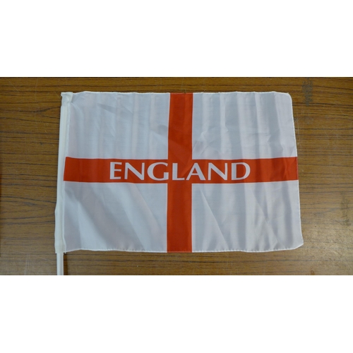 2345 - A large quantity of patterned kitchen/oven gloves and 30 x 46cm St. George Cross car flags