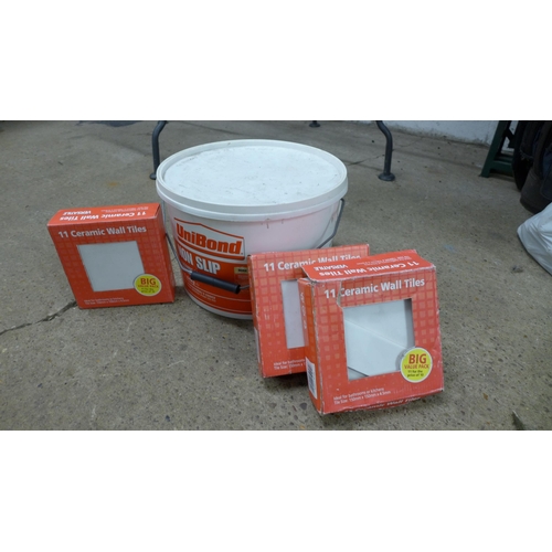 2353 - A 15kg tub of Unibond non-slip tile adhesive and two tiles tools plus 33 white wall tiles, 3 Boxes o... 