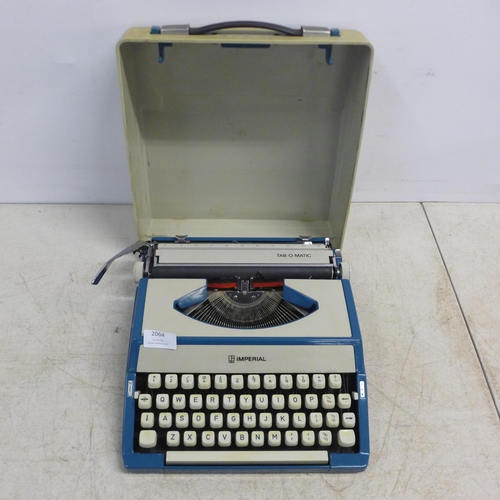 2064 - An Imperial Tab-O-Matic typewriter and a Brother Super 7300T electric typewriter