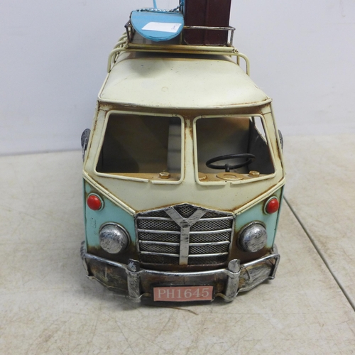 2099 - A tin plate model of a vintage VW camper van