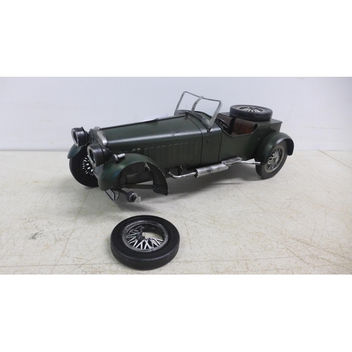 2104 - A tin plate model of a vintage car