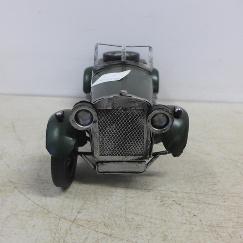 2104 - A tin plate model of a vintage car