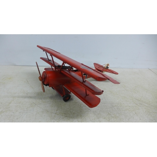 2105 - A tin plate model of a tri-plane