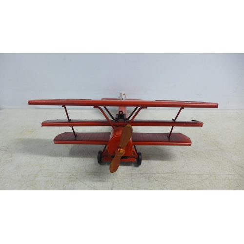 2105 - A tin plate model of a tri-plane