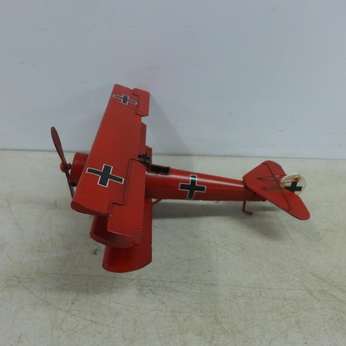 2105 - A tin plate model of a tri-plane