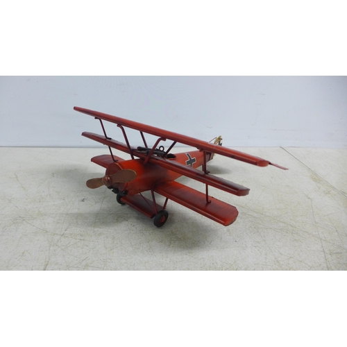 2107 - A tin plate model of a tri-plane