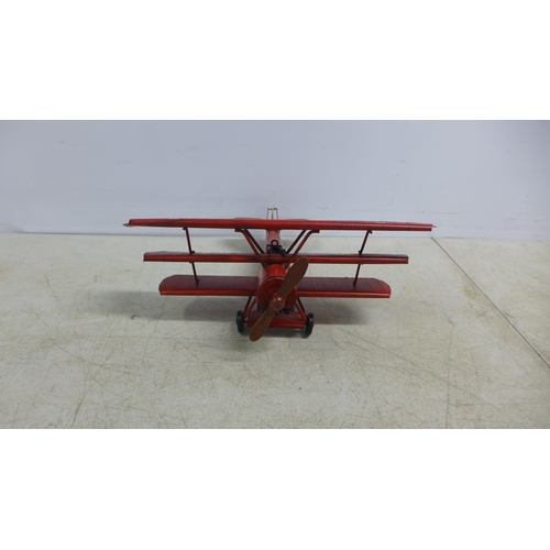 2107 - A tin plate model of a tri-plane