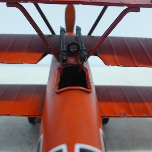 2107 - A tin plate model of a tri-plane