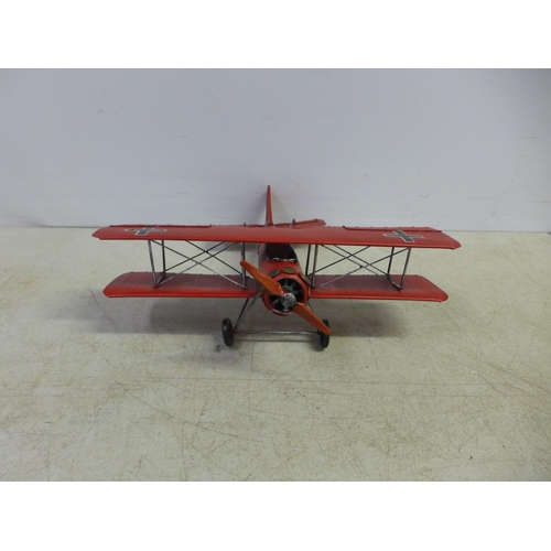 2109 - A tin plate model of a bi-plane