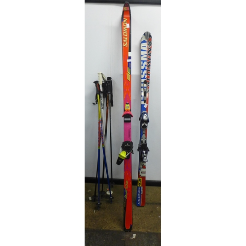 2115 - Two sets of skis- Salomon Crossmax7 L710 and a Saloman Equipe 9000 and 3 sets of sticks