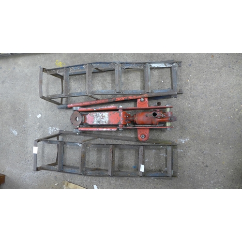 2397 - Two steel van ramps and a hydraulic trolley jack