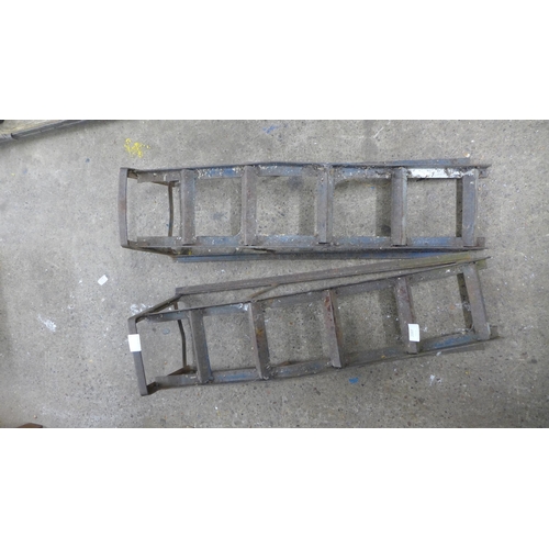 2397 - Two steel van ramps and a hydraulic trolley jack