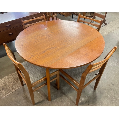 57 - A teak drop-leaf table and four chairs