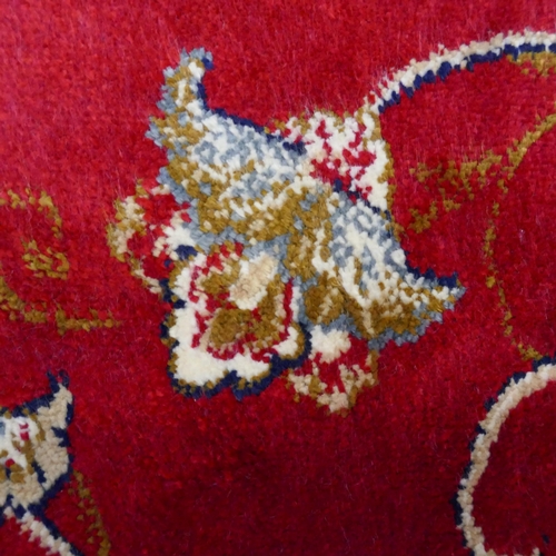 1498 - A Red ground full pile cashmere floral design rug (230x160cm)