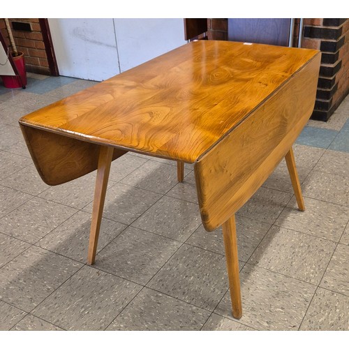 80 - An Ercol Blonde elm and beech Windsor drop-leaf table