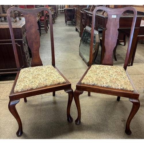 176 - A pair of Queen Anne style walnut side chairs