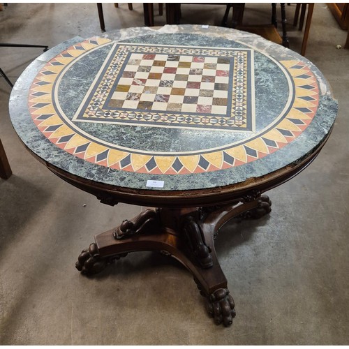 96 - A Regency mahogany and specimen marble topped circular centre/games table