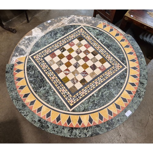 96 - A Regency mahogany and specimen marble topped circular centre/games table