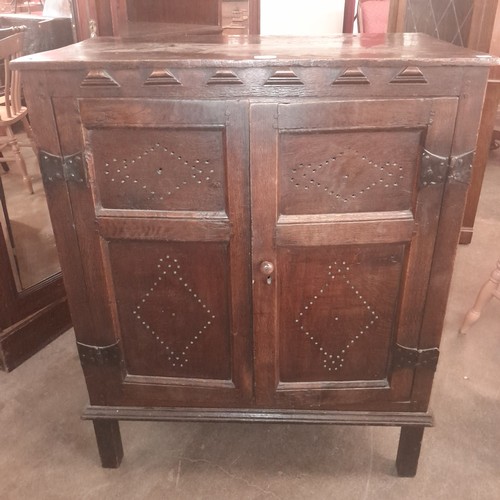 120 - A late 17th Century and later oak cupboard