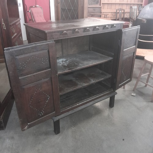 120 - A late 17th Century and later oak cupboard