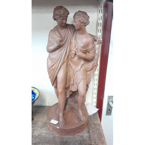 388 - A faux terracotta figure of two Romanesque ladies