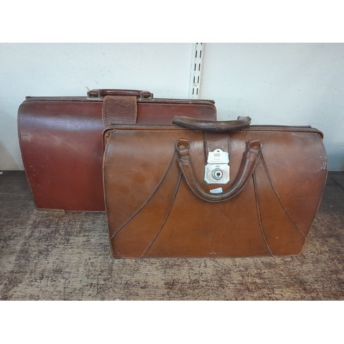 392 - Two leather Gladstone bags