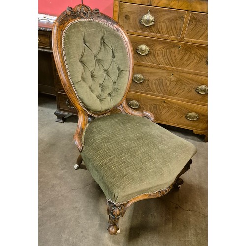 101 - A Victorian carved oak and fabric upholstered lady's chair