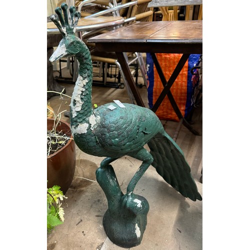 305 - A cast metal garden figure of a peacock