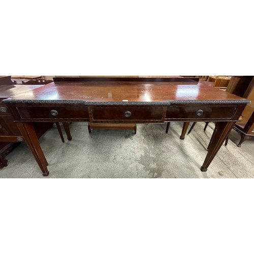 146 - An Edward VII mahogany three drawer breakfront serving table