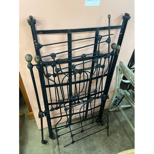 307A - A Victorian wrought iron and brass cot