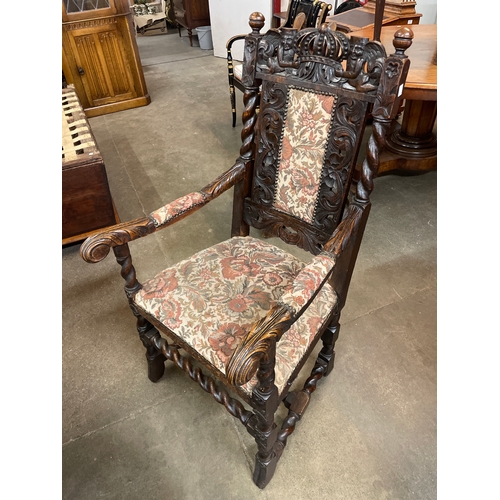 113A - A Victorian Jacobean Revival carved oak armchair