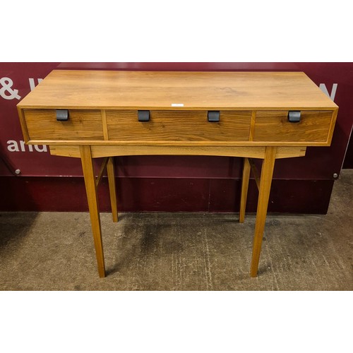 5 - An Art Deco style walnut three drawer side table