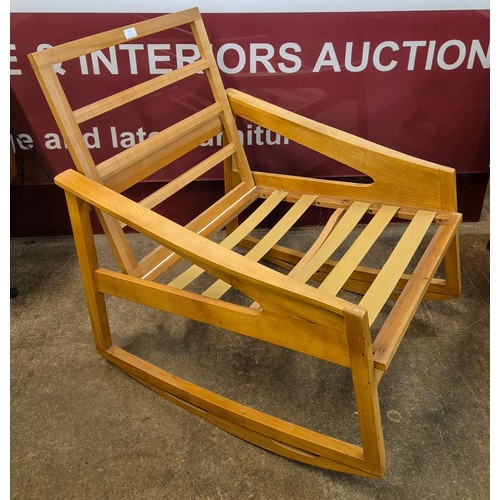 8 - A Danish style walnut rocking chair