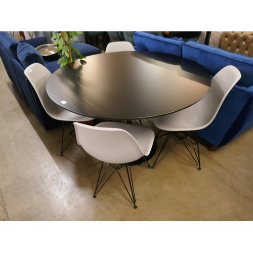 1312 - A black Tulip table - RRP £399 and four Charles and Ray Eames style chairs