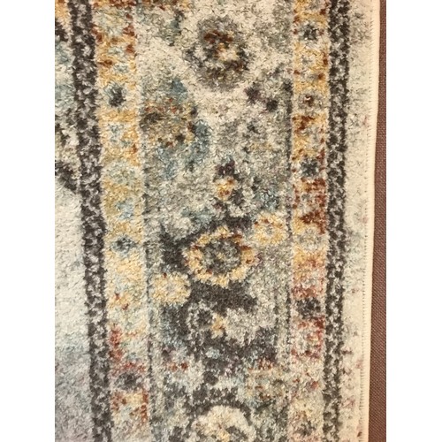 1334 - A Cream ground full pile vintage look rug with hints of duck egg blue (230x160cm)