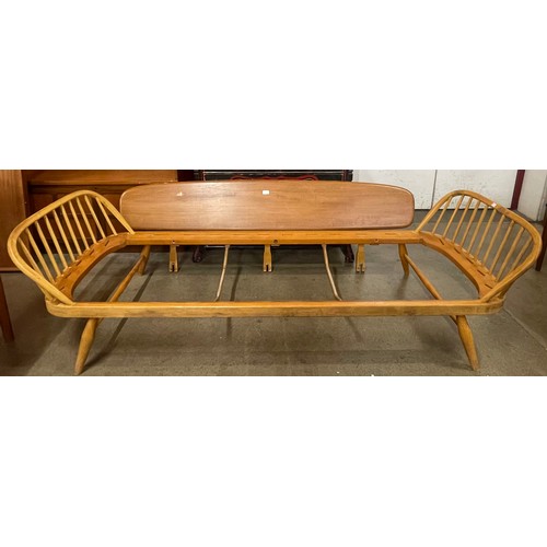 24 - An Ercol Blonde elm and beech studio couch