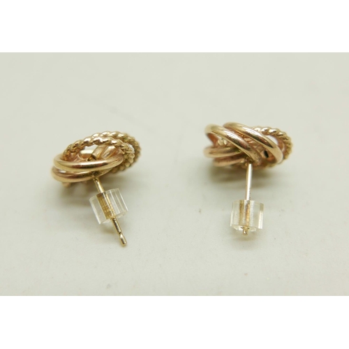 1011 - A pair of 10k gold knot design stud earrings, 1.6g