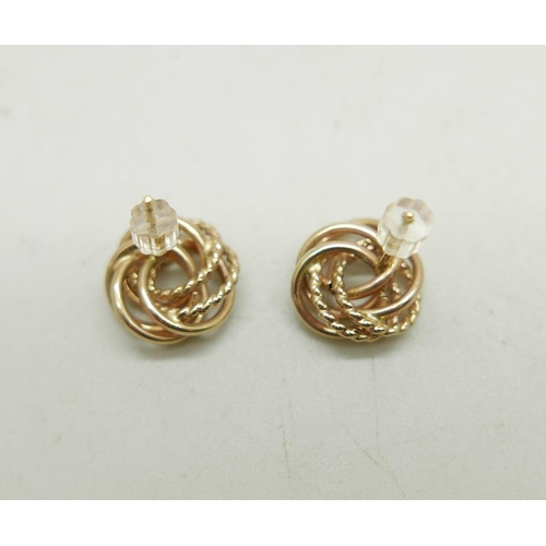 1011 - A pair of 10k gold knot design stud earrings, 1.6g