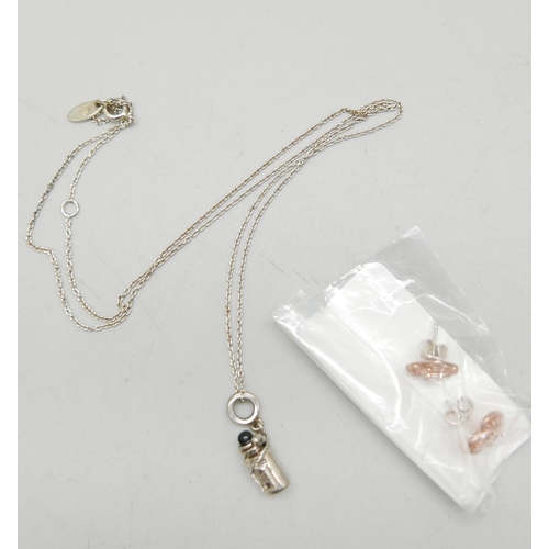 1028 - A silver Chamilia necklace with a silver Disney Alice in Wonderland 'Drink me' charm, together with ... 