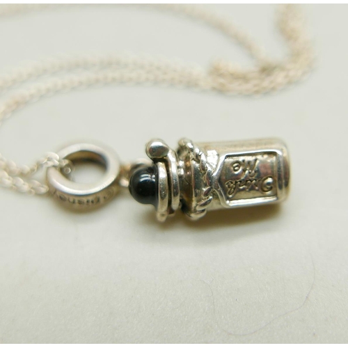 1028 - A silver Chamilia necklace with a silver Disney Alice in Wonderland 'Drink me' charm, together with ... 