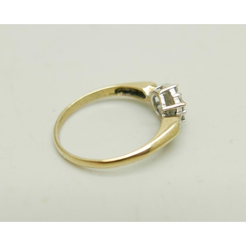 1030 - A 9ct gold and diamond cluster ring, 1.6g, L