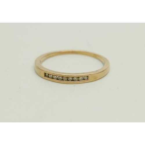 1031 - A 9ct gold ring set with small diamonds, 1.8g, R