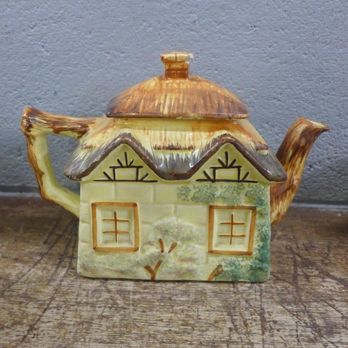 1038 - Three pieces of Keele St. pottery, a teapot, and a jug and sugar bowl, two pieces of Price Bros cott... 