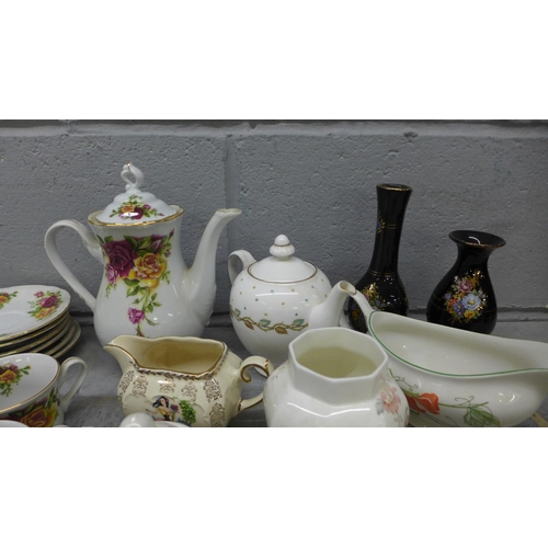 1052 - A collection of china including Lurpak toast rack, egg cups and butter dish, a Thun Czech floral tea... 