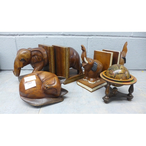 1053 - Two pairs of carved bookends in the form of elephants, a wooden globe, and a carved wooden cat **PLE... 