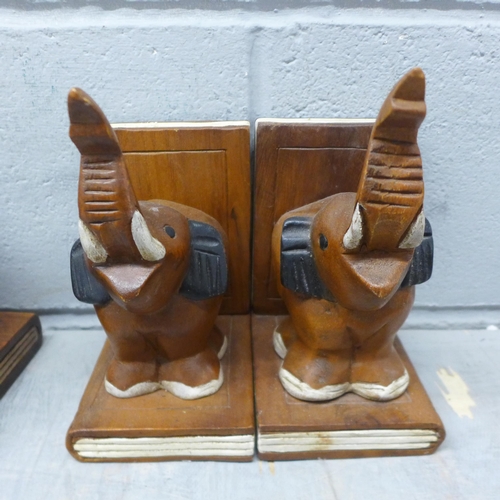 1053 - Two pairs of carved bookends in the form of elephants, a wooden globe, and a carved wooden cat **PLE... 