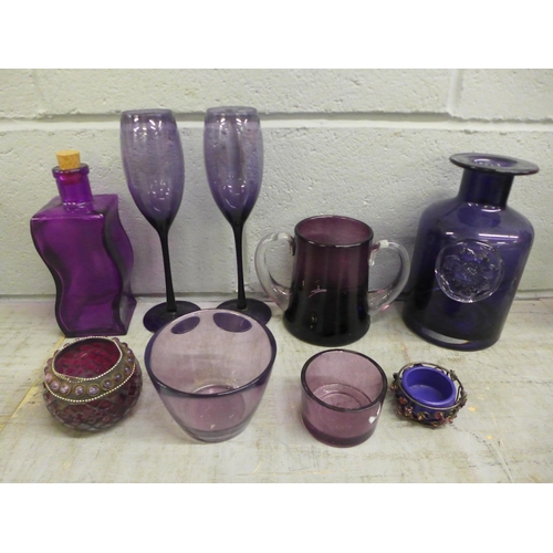 1059 - A collection of amethyst glass and dressing table items including trinket boxes and perfume bottles,... 