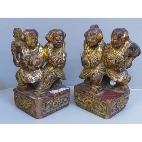 615 - Two antique Chinese wooden carved and gilt temple figures, 12cm