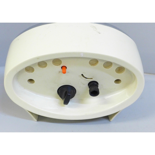 639 - A 1960s Rhythm mechanical alarm clock, two jewels movement