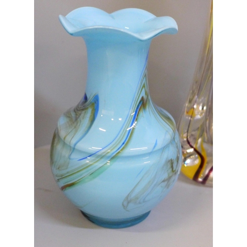 657 - Coloured glass comprising a Mtarfa jug, a signed art glass bud vase with trail design, a blue glass ... 